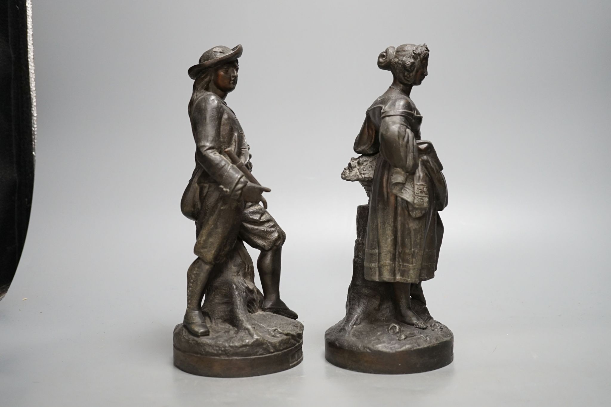 A pair of French cast metal figures, Hiver and Printemps, 25.5cm